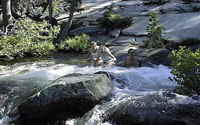 A Cascade River pool cools down these hikers from Lake Village's vacation rental condoiniums.