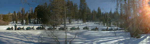 Snowmobiling along a Lake Tahoe Trail