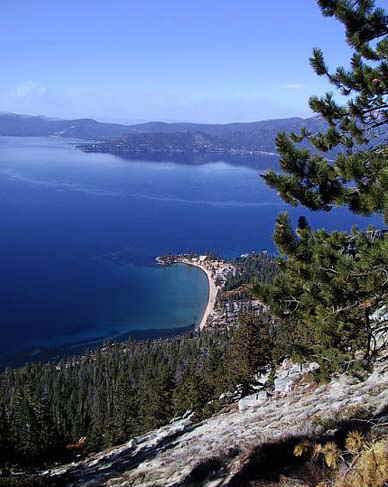 Lake Tahoe beaches are accessible to Accommodation Tahoe guests on foot just across the highway from Lake Village.